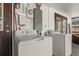 Laundry room featuring washer, dryer, and doors to the outside at 608 William Ave, Winter Haven, FL 33880