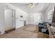 Open living room featuring tile floors, white walls, sofa, and ceiling fan at 608 William Ave, Winter Haven, FL 33880