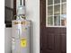 Water heater in the utility room at 608 William Ave, Winter Haven, FL 33880