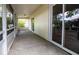 A screened-in patio with sliding glass doors offers an indoor/outdoor living space at 612 Muskrat Dr, Kissimmee, FL 34759