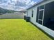 The large, well-maintained backyard with a privacy fence and screened-in patio at 6316 Dolostone Dr, Lakeland, FL 33811