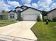 Beautiful single-story home featuring a two-car garage and a well-maintained lawn at 6316 Dolostone Dr, Lakeland, FL 33811
