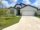 Charming single-story home with a well-manicured lawn and a two-car garage at 6316 Dolostone Dr, Lakeland, FL 33811