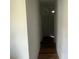 Hallway with hardwood floors, neutral walls, and recessed lighting at 6316 Dolostone Dr, Lakeland, FL 33811
