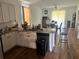 Bright kitchen featuring granite countertops, stainless steel appliances, and modern lighting at 6316 Dolostone Dr, Lakeland, FL 33811