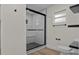 Walk-in shower with glass door and a white subway tile surround at 6320 Newman E Cir, Lakeland, FL 33811