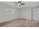 Neutral bedroom features a window and closet space, and modern flooring and paint at 6320 Newman E Cir, Lakeland, FL 33811