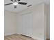 Bedroom with closet, neutral paint, modern fan and updated flooring at 6320 Newman E Cir, Lakeland, FL 33811