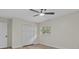 Neutral bedroom features a window and closet space, and modern flooring and paint at 6320 Newman E Cir, Lakeland, FL 33811