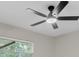 Bedroom featuring modern ceiling fan, window, and neutral paint at 6320 Newman E Cir, Lakeland, FL 33811
