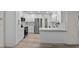 Spacious white kitchen featuring quartz countertops, stainless appliances and ample storage at 6320 Newman E Cir, Lakeland, FL 33811