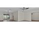 Bright living room featuring wood floors, contemporary ceiling fan, and sliding glass doors at 6320 Newman E Cir, Lakeland, FL 33811