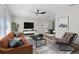 Living room with modern furniture, wood floors, and lots of natural light at 6320 Newman E Cir, Lakeland, FL 33811