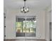 Living room showing backyard with sliding glass doors at 6320 Newman E Cir, Lakeland, FL 33811