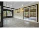 Spacious screened porch featuring neutral tile flooring and a ceiling fan for comfort at 6320 Newman E Cir, Lakeland, FL 33811