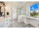 Bathroom with black fixtures, white vanity, and lots of space at 6344 Old Lake Wilson Rd, Davenport, FL 33896