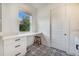 Bathroom with patterned tile floors, built-in desk, and a wooden stool at 6344 Old Lake Wilson Rd, Davenport, FL 33896