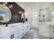 Bright bathroom with black fixtures and white vanity at 6344 Old Lake Wilson Rd, Davenport, FL 33896