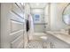 Modern bathroom with tiled shower, hexagon tile floor, and modern vanity at 6344 Old Lake Wilson Rd, Davenport, FL 33896
