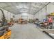 Spacious interior of a metal building with high ceilings and ample storage space at 6344 Old Lake Wilson Rd, Davenport, FL 33896