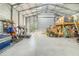 Interior of a metal building showing the open layout and storage space, including a mezzanine at 6344 Old Lake Wilson Rd, Davenport, FL 33896