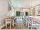 Bright kitchen with a dining area featuring stainless steel appliances and natural light at 6344 Old Lake Wilson Rd, Davenport, FL 33896