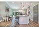 Bright kitchen with white cabinets, modern island, and stainless steel appliances at 6344 Old Lake Wilson Rd, Davenport, FL 33896