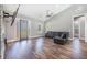 Spacious living room featuring hardwood floors, modern design, and ample natural light at 6344 Old Lake Wilson Rd, Davenport, FL 33896