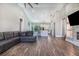 Bright living space with high ceilings, wood floors, and open floor plan at 6344 Old Lake Wilson Rd, Davenport, FL 33896