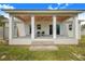 Covered outdoor patio featuring a wood ceiling, ceiling fan, and two chairs at 6344 Old Lake Wilson Rd, Davenport, FL 33896