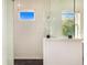 Modern shower featuring white subway tile, black hardware, and sleek glass enclosure and mosaic tile flooring at 6344 Old Lake Wilson Rd, Davenport, FL 33896