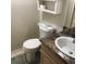 Well-maintained bathroom featuring a modern sink, toilet, and vanity at 6398 Lolly Bay Ne Loop, Winter Haven, FL 33881