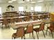 A spacious event hall with tables and chairs, perfect for community gatherings at 6398 Lolly Bay Ne Loop, Winter Haven, FL 33881