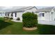 Well-maintained home with lush green lawn and beautiful landscaping at 6398 Lolly Bay Ne Loop, Winter Haven, FL 33881