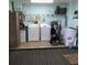 Spacious laundry room with washer, dryer, and ample storage solutions at 6398 Lolly Bay Ne Loop, Winter Haven, FL 33881