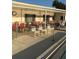 Community pool area with seating, tables, and a covered patio for residents at 6398 Lolly Bay Ne Loop, Winter Haven, FL 33881