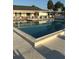 A large, rectangular community swimming pool offers a refreshing retreat with ample space for swimming at 6398 Lolly Bay Ne Loop, Winter Haven, FL 33881