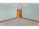 Bedroom with tiled floor, ceiling fan and a wood framed doorway at 6925 Alturas Babson Park Cutoff, Bartow, FL 33830
