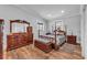Bright bedroom featuring wood floors and elegant furnishings at 6925 Alturas Babson Park Cutoff, Bartow, FL 33830