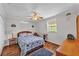 Cozy bedroom with a ceiling fan, window views, and warm lighting at 6925 Alturas Babson Park Cutoff, Bartow, FL 33830