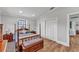 Bright bedroom featuring wood floors and elegant furnishings at 6925 Alturas Babson Park Cutoff, Bartow, FL 33830