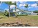 Beautiful two-story home featuring a covered porch, well maintained lawn, and an inviting pool at 6925 Alturas Babson Park Cutoff, Bartow, FL 33830