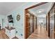 Hallway with wood flooring, wooden closet doors, light blue walls and nautical decorations at 6925 Alturas Babson Park Cutoff, Bartow, FL 33830