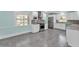 Bright kitchen featuring white cabinets, stainless steel appliances, and granite counters at 6925 Alturas Babson Park Cutoff, Bartow, FL 33830