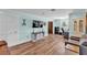 Spacious living room with wood floors, modern decor, and plenty of natural light at 6925 Alturas Babson Park Cutoff, Bartow, FL 33830