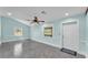 Bright living room featuring grey tile floors, recessed lighting, and white trim at 6925 Alturas Babson Park Cutoff, Bartow, FL 33830