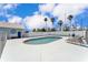 Backyard pool with white pool deck and tropical landscaping at 6925 Alturas Babson Park Cutoff, Bartow, FL 33830