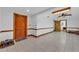 Large bonus room with tiled floor and paneled door to an adjacent room at 6925 Alturas Babson Park Cutoff, Bartow, FL 33830