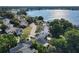 Stunning aerial view featuring a lake nearby highlighting the property's desirable location and community at 711 Lake Dexter Cir, Winter Haven, FL 33884