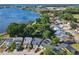 Aerial view of a neighborhood near a lake, showcasing landscaping and rooflines at 711 Lake Dexter Cir, Winter Haven, FL 33884